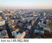 Aerial photography from the drone to the National Sanctuary Complex Kyiv Sophia , the St. Michael’s Golden-Domed Monastery and other historical places in Kiev, Ukraine, a shot at sunset in the summer.. Panoramic aerial view from the drone, a view of the bird’s eye view of the the central historical part of the city of Kiev, Ukraine, with old buildings of the city. Стоковое фото, агентство Ingram Publishing / Фотобанк Лори