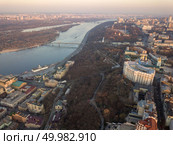 Panoramic view of the Ministry of the Interior, Pochtovaya Ploshcha, River Station and Pedestrian Bridge across the Dnieper River in the city of Kiev, Ukraine. Photo from the drone. Ministry of the Interior, Pochtovaya Ploshcha, River Station and Pedestrian Bridge across the Dnieper River in the city of Kiev. Стоковое фото, агентство Ingram Publishing / Фотобанк Лори