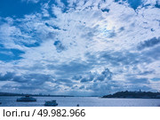 beautiful view of a blue sky with white clouds, sea with boats and the city of Istanbul on the horizon line. beautiful view of the sky, the sea and the city. Стоковое фото, агентство Ingram Publishing / Фотобанк Лори