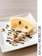 Crape with green tea ice cream with chocolate sauce. Стоковое фото, агентство Ingram Publishing / Фотобанк Лори