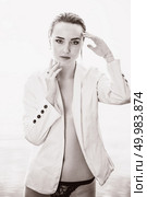 attractive girl in a white jacket stood by the river at dawn. beauty, fashion, portrait, outdoor. Стоковое фото, агентство Ingram Publishing / Фотобанк Лори