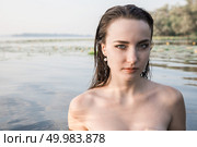attractive girl on his shoulders in the river at dawn. beauty, fashion, portrait, outdoor. Стоковое фото, агентство Ingram Publishing / Фотобанк Лори