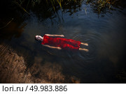 immersion in black waters. Attractive sensual girl in water with reflection of clouds. Стоковое фото, агентство Ingram Publishing / Фотобанк Лори