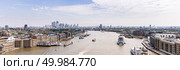London cityscape with River Thames to Canary Wharf skylines building in London UK Panorama. Стоковое фото, агентство Ingram Publishing / Фотобанк Лори