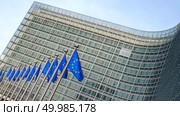 Flags in front of the EU Commission building in Brussels. European flags in front of the Berlaymont building. Стоковое фото, агентство Ingram Publishing / Фотобанк Лори