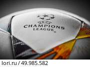 Kiev, Ukraine - February 22, 2018: The upper part of the Official Ball Adidas with Ukrainian symbols for the final of the Champions League on a gray background, there is the inscription final of the Champions League 2017-2018 will be held in Kiev on May 26.. Kiev, Ukraine - February 22, 2018: Official Ball Adidas with Ukrainian symbols for the final of the Champions League. Редакционное фото, агентство Ingram Publishing / Фотобанк Лори