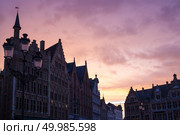 view of Old Markt square with a beautiful sunset sky natural light. Belgium. view of Old Markt square. Редакционное фото, агентство Ingram Publishing / Фотобанк Лори