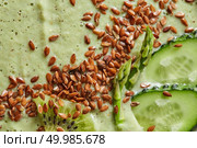 Appetizing smoothie from avocado with cucumber and flax seeds. Dietary and healthy diet. Macro photo. Macro photo of vegetable smoothie with flax seeds. Dietary food. Стоковое фото, агентство Ingram Publishing / Фотобанк Лори