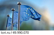 Bitcoin Currency Symbol on flag of the European Union. Conceptual image for crypto currency market,can be used for video or site cover or news. State regulation of the functioning of the crypto currency market in Europe. Bitcoin Currency Symbol on EU Flag. Стоковое фото, агентство Ingram Publishing / Фотобанк Лори
