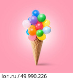 Waffle cornet with balloons isolated on pink. Waffle cornet with balloons. Стоковое фото, агентство Ingram Publishing / Фотобанк Лори