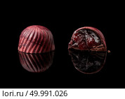 tasty yellow chocolate candy on a black background. chocolate candy on black background. Стоковое фото, агентство Ingram Publishing / Фотобанк Лори