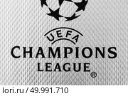 Kiev, Ukraine - February 22, 2018: Macro photo inscription on leather ball macro UEFA Champions League, first Ukrainian final ball for the Champions League, during UEFA Champions League game at NSC Olimpiyskyi stadium on May 26, 2018 in Kiev, Ukraine,. Kiev, Ukraine - February 22, 2018: Macro photo inscription on leather ball macro UEFA Champions League on the official ball for the game in the final. Редакционное фото, агентство Ingram Publishing / Фотобанк Лори