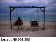 beach view at noon with swing chair photo. beach view at noon with swing chair. Стоковое фото, агентство Ingram Publishing / Фотобанк Лори