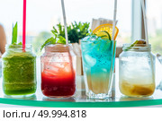 variety of iced fruit juice cocktail and mocktail on glass table. Стоковое фото, агентство Ingram Publishing / Фотобанк Лори