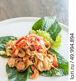 Crispy fish maw and dried shrimp in spicy salad. Стоковое фото, агентство Ingram Publishing / Фотобанк Лори