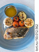 Grilled seabass fish  with grilled vegetable. Стоковое фото, агентство Ingram Publishing / Фотобанк Лори