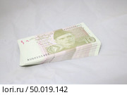 10 rupees Pakistani currency note. Редакционное фото, агентство Ingram Publishing / Фотобанк Лори