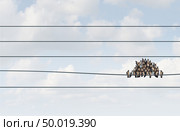 Concept of crowd funding  and crowdsourcing or crowdfunding as a social organization with followers crowded together following a herd mentality with 3D illustration elements. Стоковое фото, агентство Ingram Publishing / Фотобанк Лори