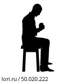 Man holding mug and looking at the contents inside while sitting on stool Concept of calm and home comfort icon black color vector illustration flat style simple image. Стоковая иллюстрация, агентство Ingram Publishing / Фотобанк Лори