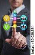 Businessman navigating a futuristic interface with digital icons. Стоковое AI-видео, аниматор Юрий Поздников / Фотобанк Лори