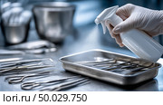 Sterilization of surgical instruments in a medical facility during the day. Стоковое AI-изображение, AI-художник Katsiaryna Repich / Фотобанк Лори