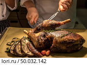 Carving of Roasted lamb meat. Стоковое фото, агентство Ingram Publishing / Фотобанк Лори