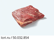 Fresh raw natural beef meat for cooking isolated on white background with shadows, place for text. Raw organic pound of flesh for roasting isolated on a white background with shadows, copy space. Стоковое фото, агентство Ingram Publishing / Фотобанк Лори