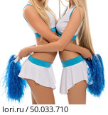 Alluring blondes posing in cheerleading uniforms. Стоковое фото, фотограф Гурьянов Андрей / Фотобанк Лори