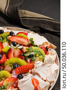 Pavlova cake with fresh blueberries, strawberries and kiwi. Стоковое фото, агентство Ingram Publishing / Фотобанк Лори