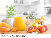 Multifruit juice and fresh fruit on table on kitchen background closeup. Стоковое фото, агентство Ingram Publishing / Фотобанк Лори