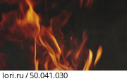 Burning fire flame on dark background. Стоковое видео, видеограф Михаил Коханчиков / Фотобанк Лори
