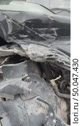 The car was seriously damaged as a result of a recent collision and a traffic accident. This close-up image shows a car with extensive damage to the front as a result of a serious accident. Стоковое видео, видеограф worker / Фотобанк Лори