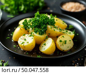 Potatoes are disgusting on a dark table. AI generated. Стоковое AI-изображение, AI-художник Анна Никонорова / Фотобанк Лори
