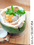 coconut affogato with espresso shot and ice cream italian dessert, served in whole coconut. Стоковое фото, агентство Ingram Publishing / Фотобанк Лори