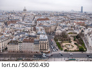 top view of one of the towers of Notre Dame . In the background is seen Pantheon of Paris.. top view on Paris . Стоковое фото, агентство Ingram Publishing / Фотобанк Лори