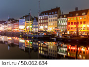 Copenhagen Nyhavn, New port of Copenhagen, at night in Denmark. Стоковое фото, агентство Ingram Publishing / Фотобанк Лори