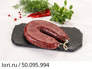 Delicious dry cured beef basturma on table, closeup. Стоковое фото, фотограф Андрей Старостин / Фотобанк Лори