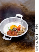 cooking of Thai Egg frying pan. Стоковое фото, агентство Ingram Publishing / Фотобанк Лори