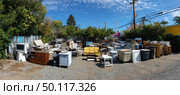 Outdoor furniture sale featuring vintage and modern pieces. Стоковое AI-изображение, AI-художник Юрий Поздников / Фотобанк Лори