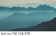 Aerial view of mountains under mist morning. Стоковое видео, видеограф Михаил Коханчиков / Фотобанк Лори