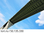 Dramatic transport pass perspective, steel bridge against blue sky with clouds. Стоковое фото, фотограф Елена  Попкова / Фотобанк Лори