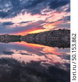 Beautiful landscape. Colorful sunset at the lake with clouds reflected in water. . Стоковое фото, агентство Ingram Publishing / Фотобанк Лори