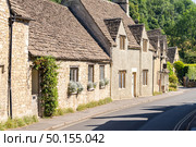 Castle Combe village in Cotswolds England UK. Стоковое фото, агентство Ingram Publishing / Фотобанк Лори