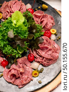 Variety of Cold cut, pork and beef salami, for salad station in buffet line. Стоковое фото, агентство Ingram Publishing / Фотобанк Лори