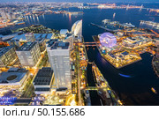 Aerial view of panoramic modern city in Yokohama City Japan with blue hour after sunset in th evening. Yokohama is the second largest city in Japan by population. Стоковое фото, агентство Ingram Publishing / Фотобанк Лори