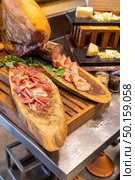 Parma Ham leg cold cut in buffet line. Стоковое фото, агентство Ingram Publishing / Фотобанк Лори