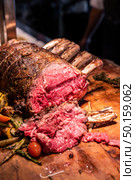 Wagyu beef roast prime rib, Carving food. Стоковое фото, агентство Ingram Publishing / Фотобанк Лори