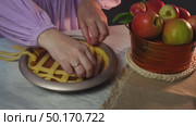 Crafting a perfect apple pie lattice crust with precision and skill. Стоковое видео, видеограф Zakharova Natasha / Фотобанк Лори