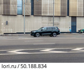 Dark green Exeed VX SUV car on the city road. Fast moving vehicle on Moscow streets. Compliance with speed limits on the road. Редакционное фото, фотограф Константин Григорьев / Фотобанк Лори