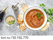 Eggplant hummus with ingredients for cooking. Traditional vegan arabic aubergine appetizer. Baba Ghanoush. Стоковое фото, агентство Ingram Publishing / Фотобанк Лори